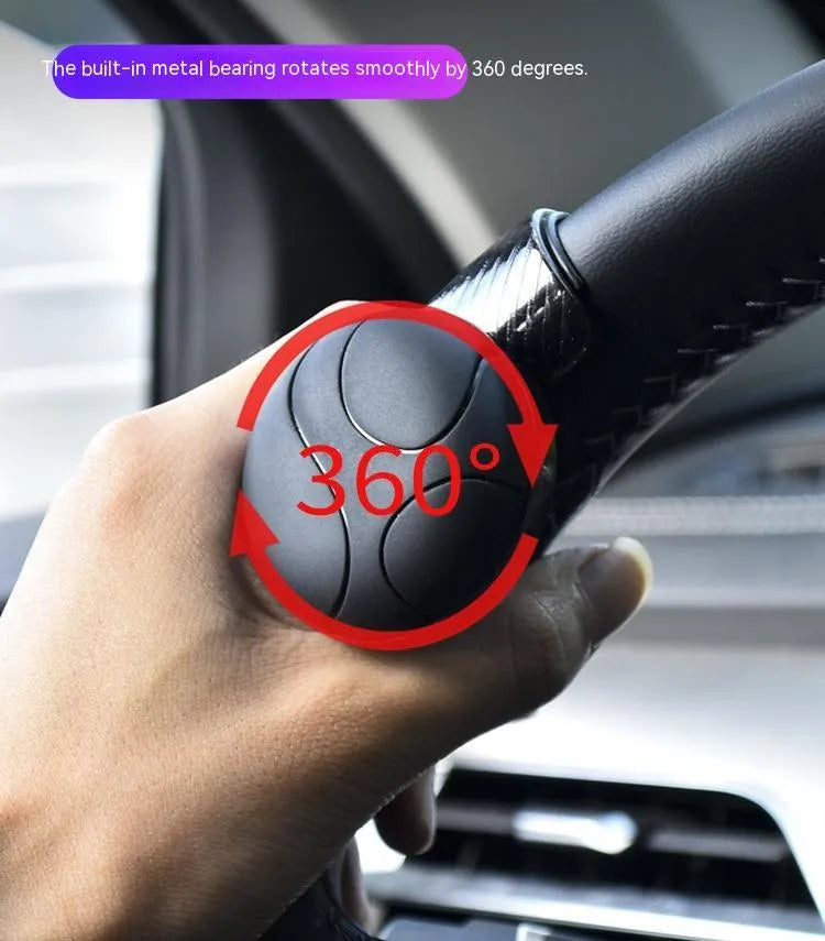 Black and blue silicone steering wheel assist ball showing round design for single-handed steering control.