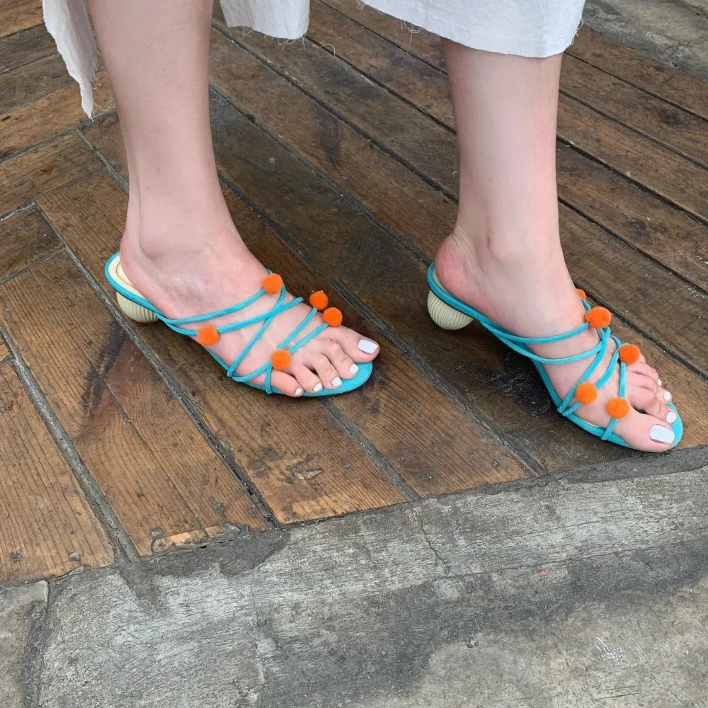 Cyan genuine leather women's sandals with lace-up straps, open toe, and a niche ball high heel.