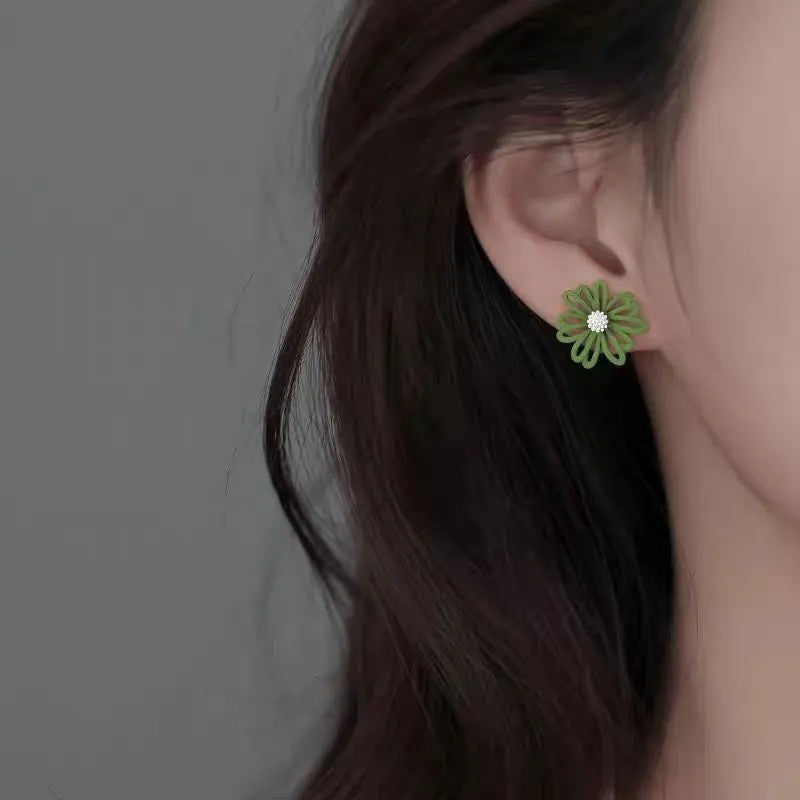 Flower-shaped alloy stud earrings in white and green, yellow and white, blue and orange colour combinations