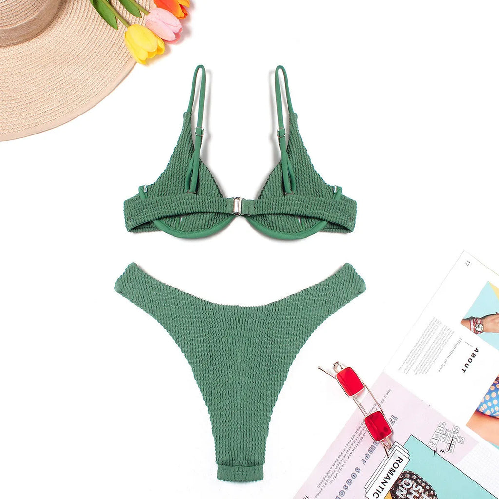 Women's green bikini swimsuit with ruffle trim top and split skirt bottom