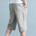 Men's cotton sports pants in loose fit straight-leg cropped design showing light grey colour option