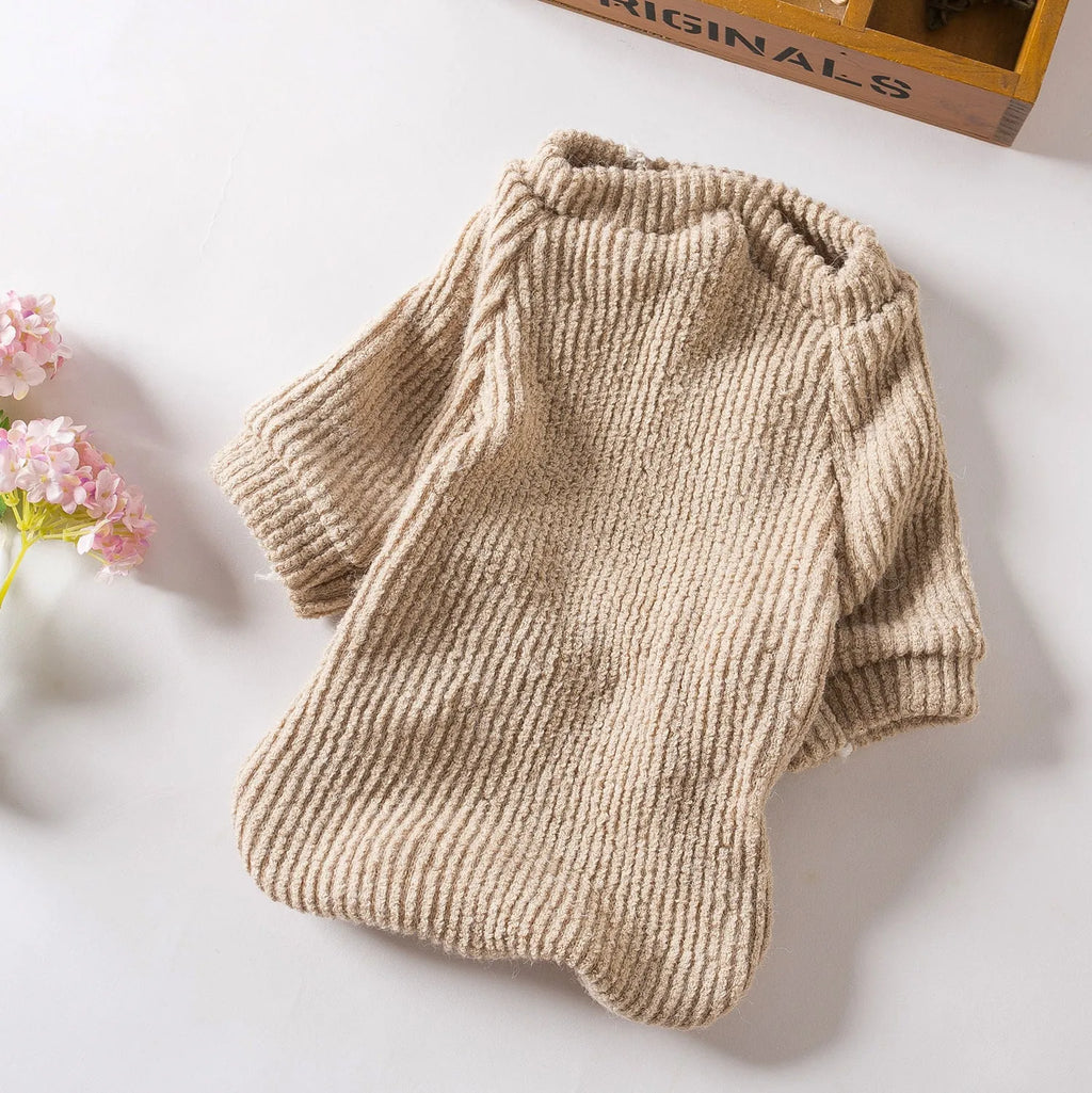 Brown cloth pullover sweater on a small dog, showing casual design.