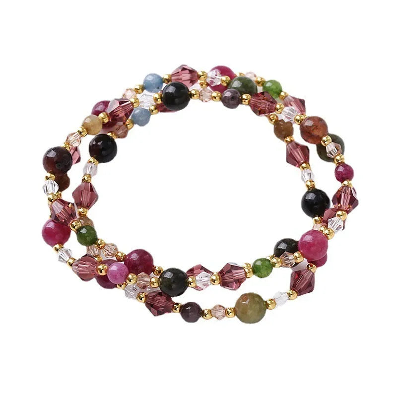 Women's three-ring bracelet with tourmaline, strawberry quartz and amethyst gemstones on adjustable cord