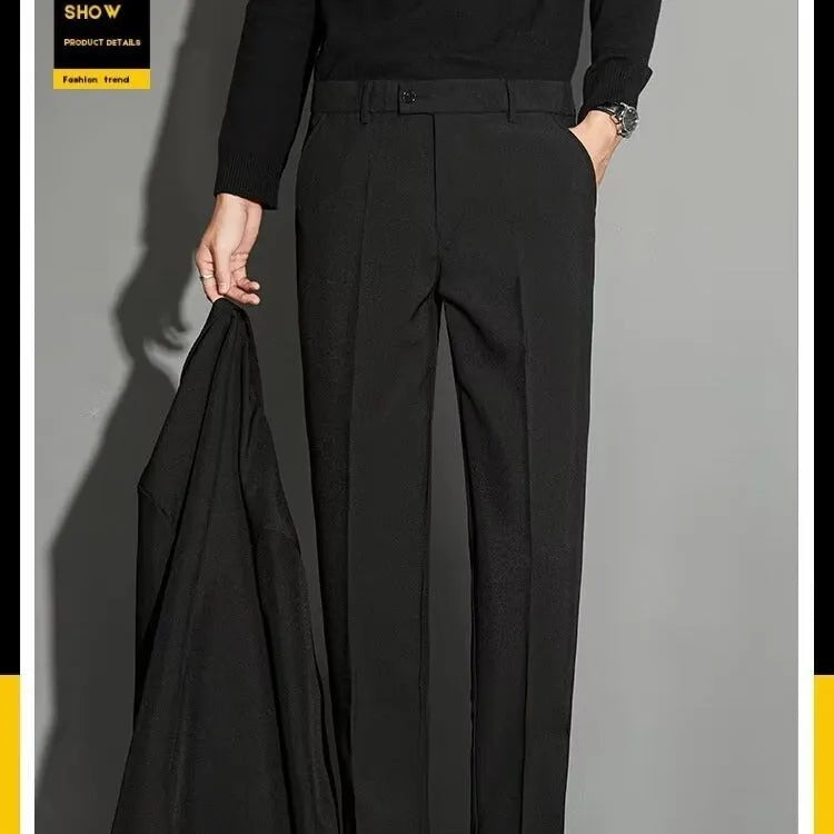 Men's straight-leg ankle-length suit trousers in a light colour showing drape and fit.