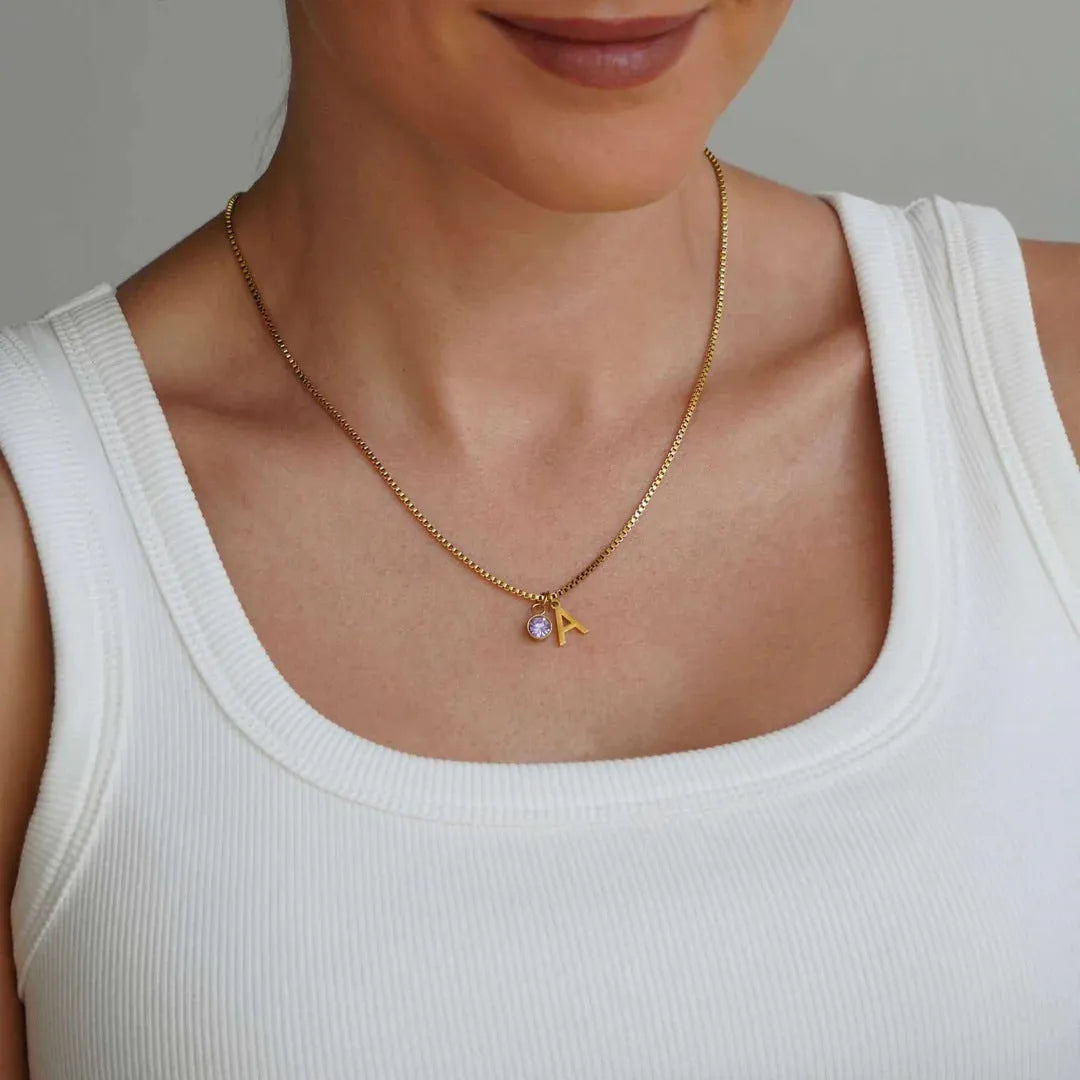 Gold and silver stainless steel birthstone first letter necklace with O-ring chain and personalised pendant