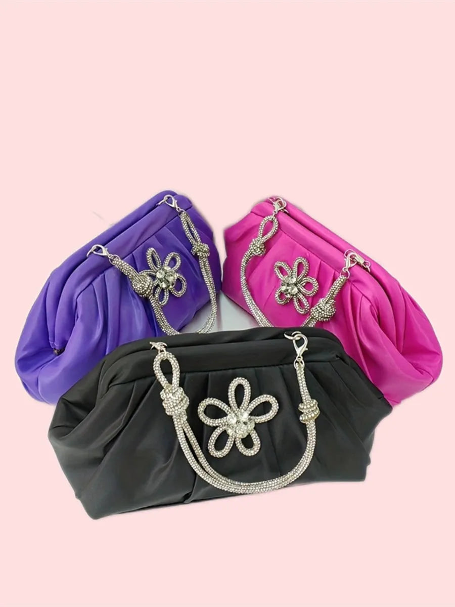 Soft lavender purple women's shoulder messenger bag with chain detail, shown in shell shape with folds.