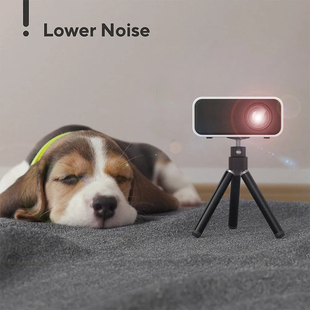 YT300 black or white portable mini projector with remote control on a table, showing compact size.