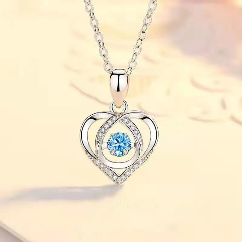 Blue diamond heart necklace and bracelet set with adjustable chain on copper background