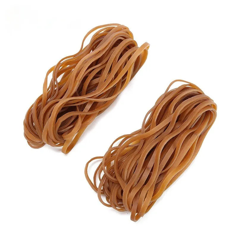 A bag containing numerous natural-coloured circular rubber elastic bands, total weight 500 grams.