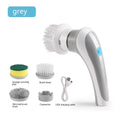 White handheld electric cleaning brush with rotating brush head on bathroom tiles