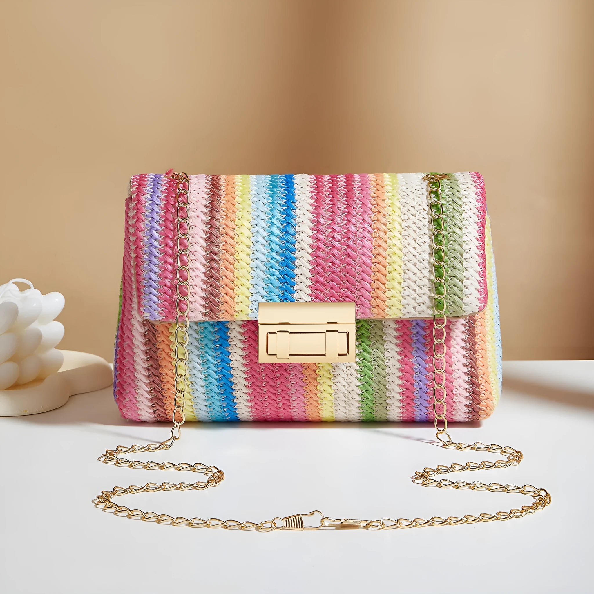 Women's straw cross-body bag with lock closure in rainbow colour option