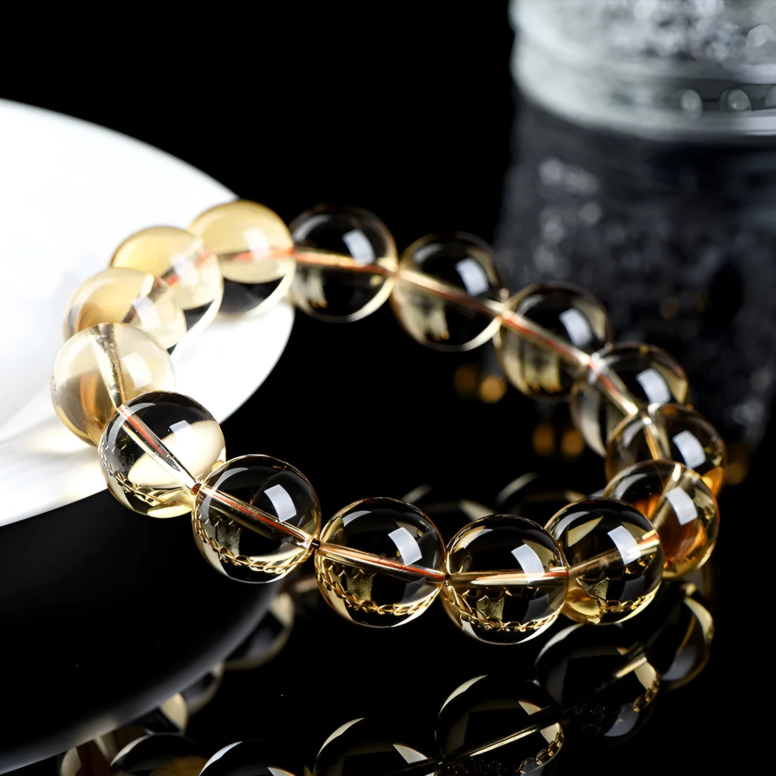 Adjustable natural citrine scattered beads bracelet on a wrist, showing polished yellow gemstones in an organic pattern.