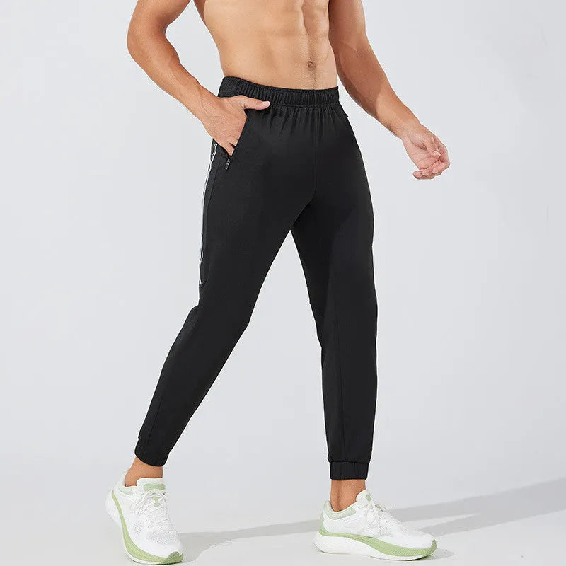 Men's black polyester running trousers with a mid waist and classic length.