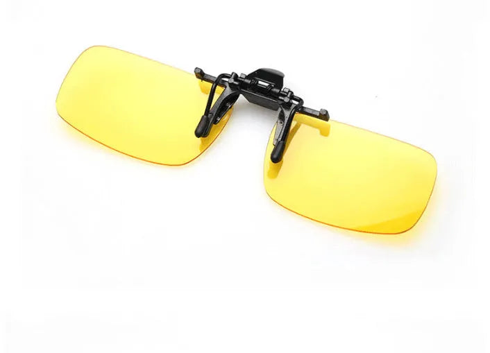 Clip-on sunglasses with polarised PC lenses attached to prescription glasses for driving