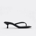 Women's khaki round-toe mid-heel flip-flop sandals with a microfiber upper and rubber sole on a white background.