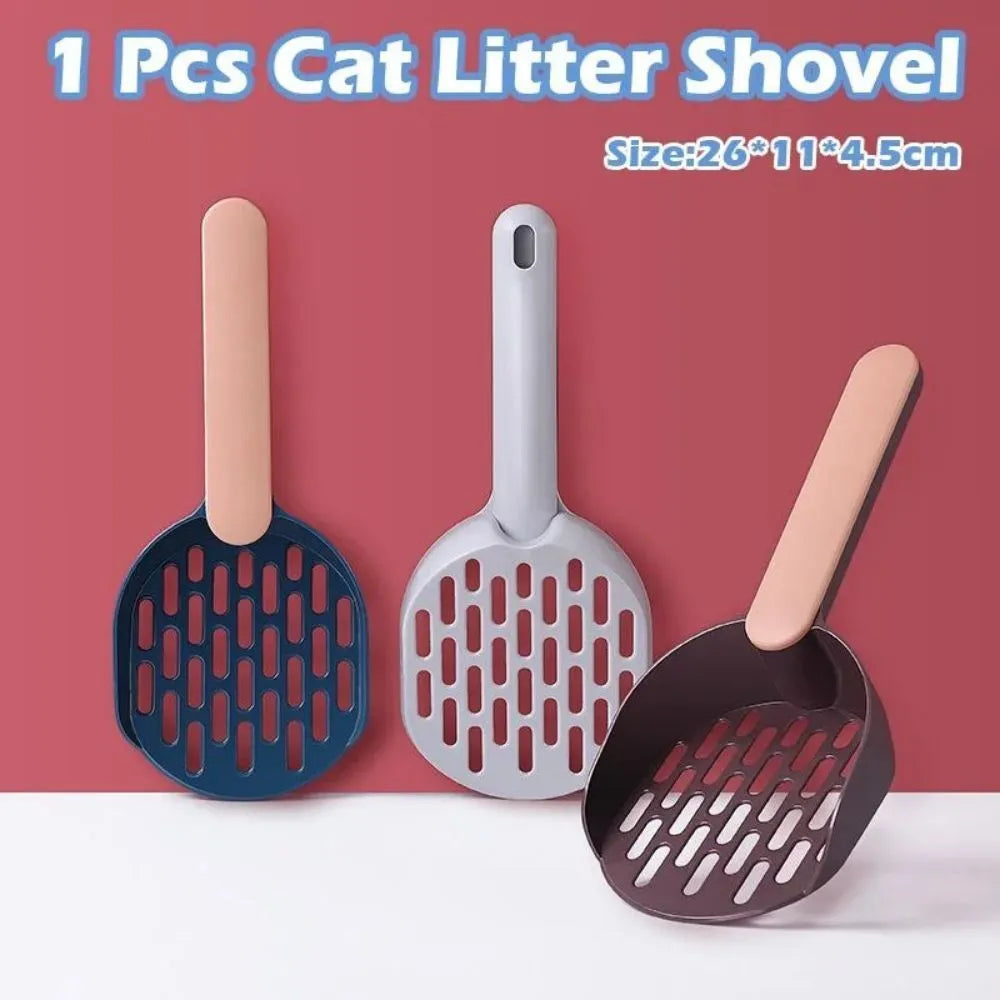 Blue plastic cat litter shovel with angled handle on a white background.