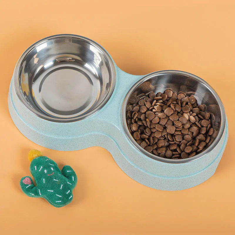 Double pet bowl set with two stainless steel bowls and blue straw holder on white background