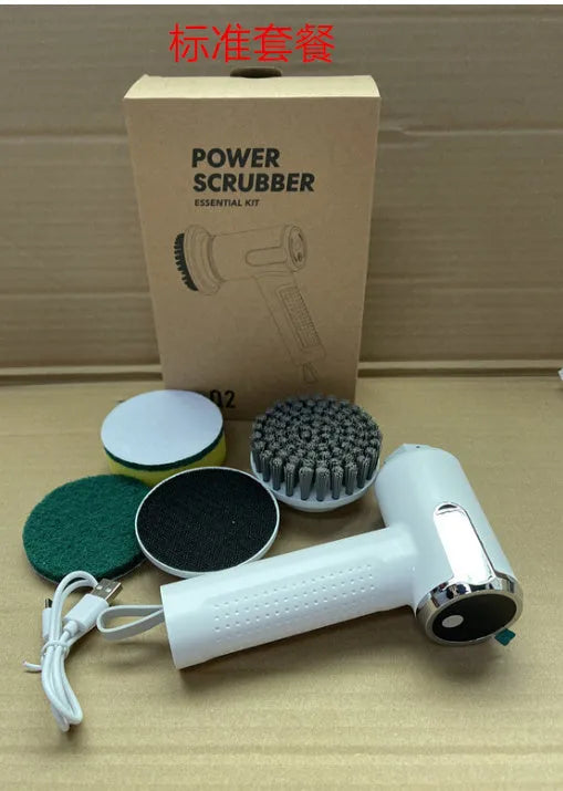 White cordless electric cleaning brush with interchangeable heads on a kitchen counter.