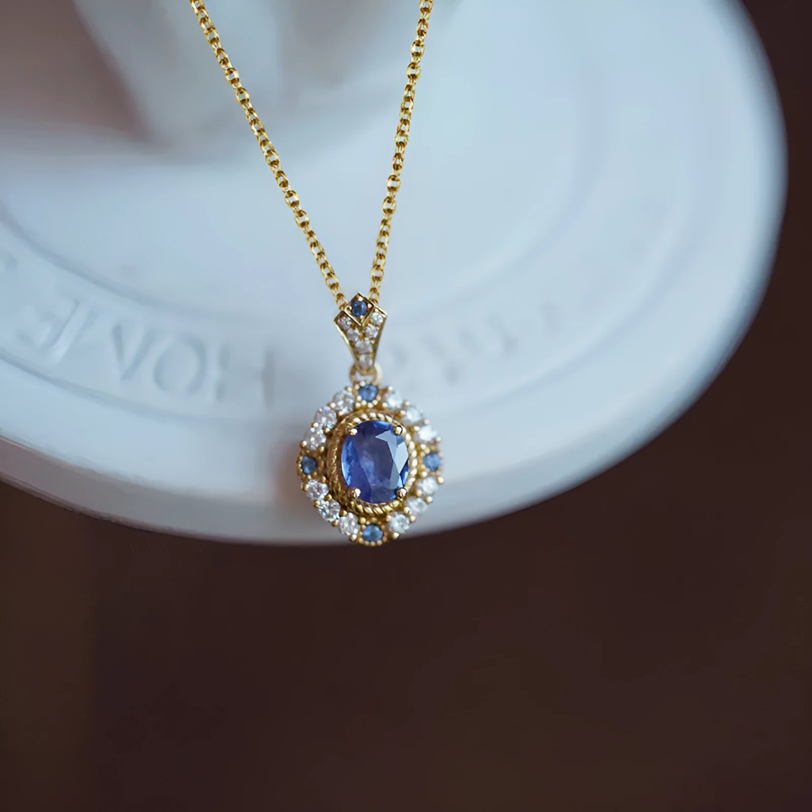 Yellow gold royal style necklace with inlaid zircon pendant on a copper box chain.