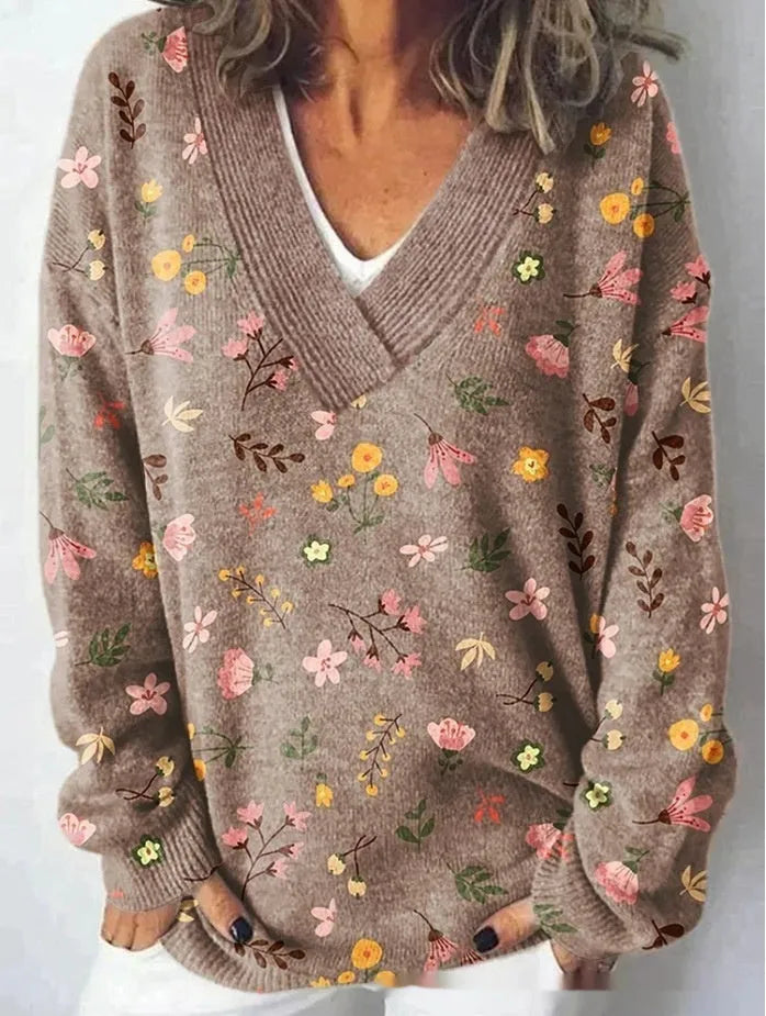 Women's V-neck long sleeve sweatshirt with a textured 3D floral print pattern in a retro style.