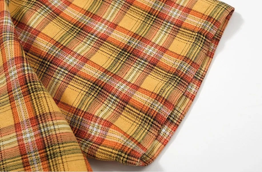 Men's yellow grid plaid short sleeve loose fit shirt on plain background