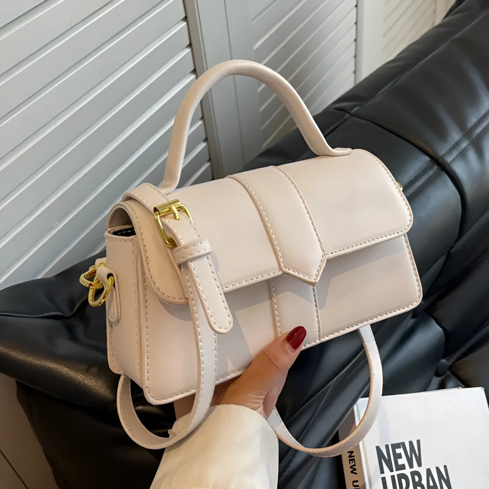 Women's beige PU messenger bag with file organiser, showing horizontal square shape and external pocket
