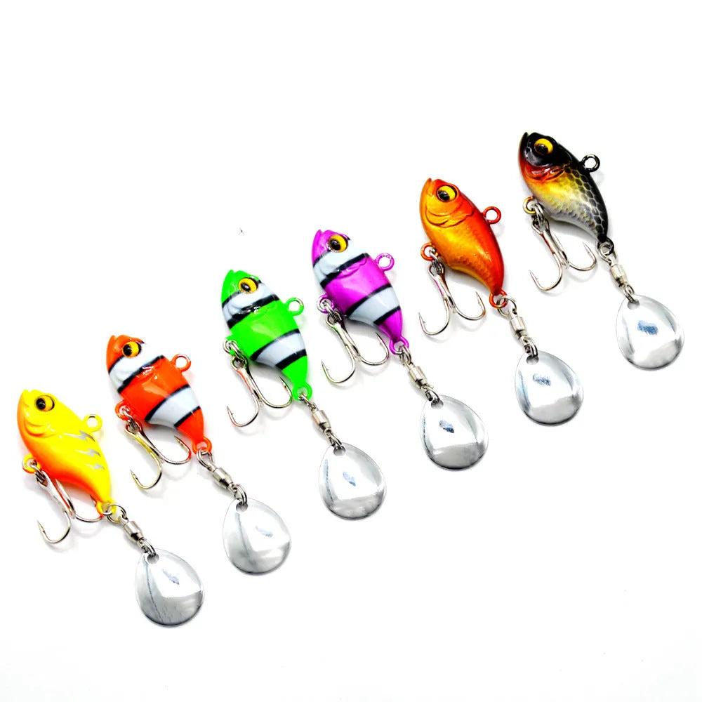 Metal sea fishing lure with a spinning sequin plate in gold colour with treble hook.