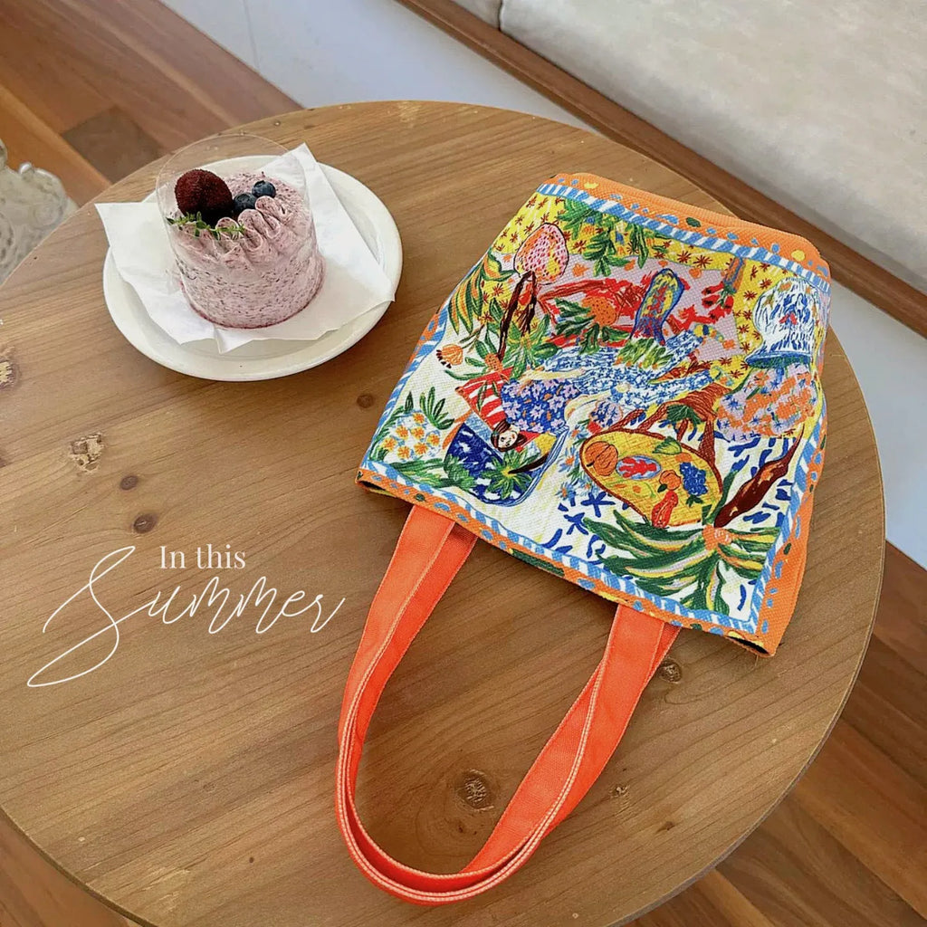 Dream Garden orange plush bucket bag with printed design, canvas lining, and double shoulder straps
