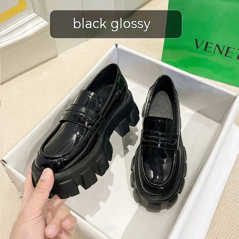 British style wide fit patent leather loafers with a rubber sole and muffin heel base.