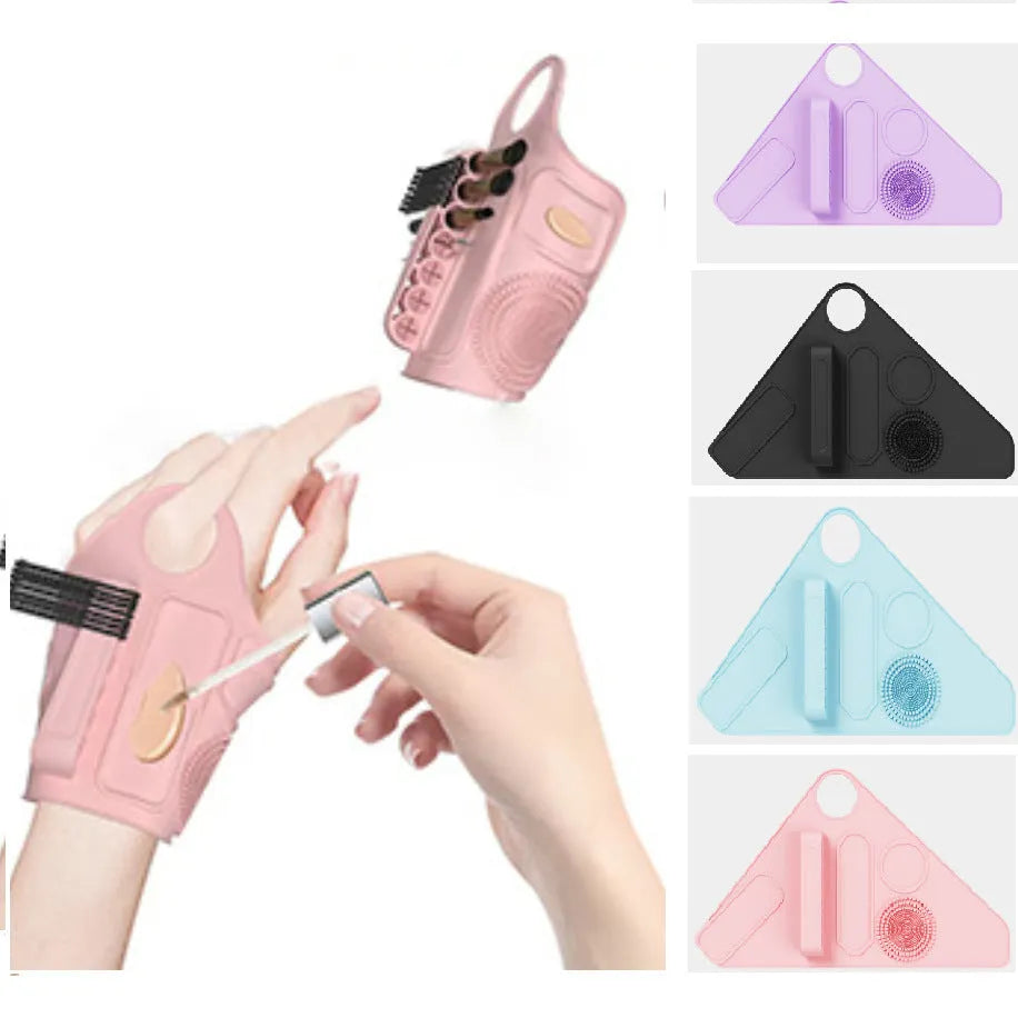 Silicone makeup hand strap in purple on a hand holding a makeup brush