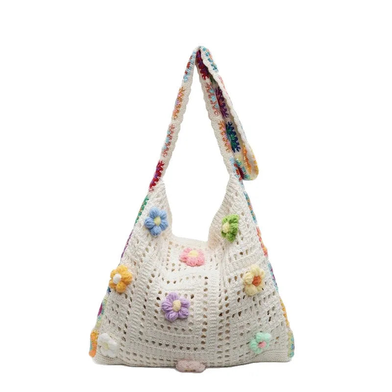 Women's woven beach shoulder bag in polyester with hollow knitted construction and single strap