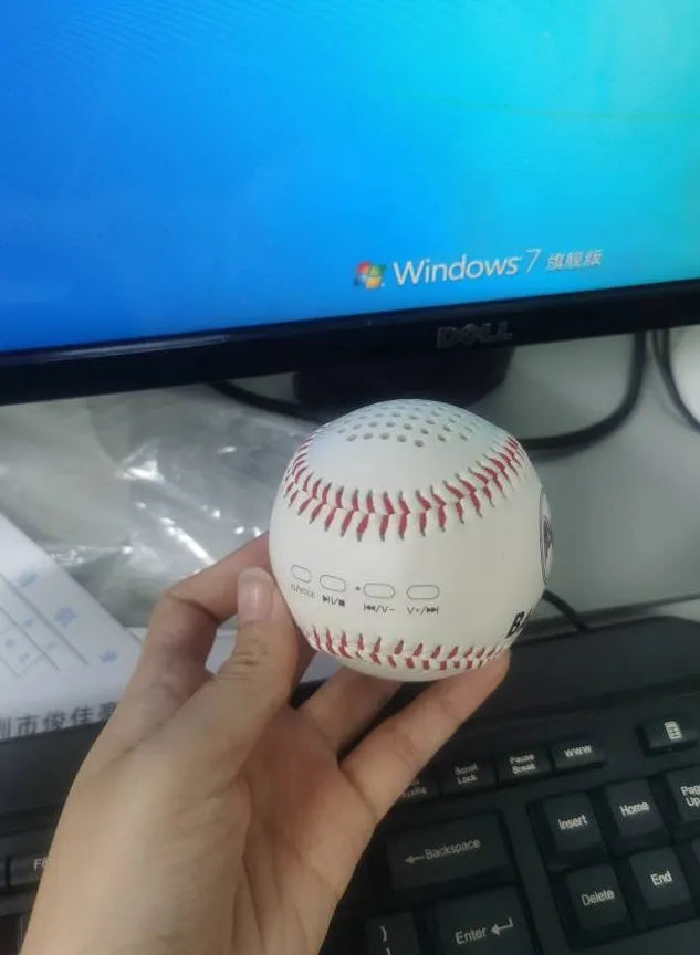 Baseball home shaped Bluetooth speaker in green colour showing front design with speaker grille