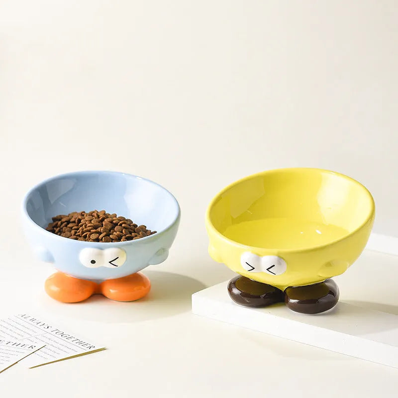 Cute Expression tall slanted ceramic pet food bowl in blue and yellow colours for cats and dogs