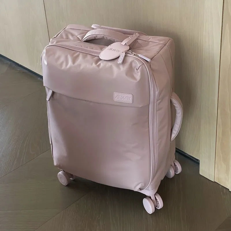 Ultra-light waterproof Oxford cloth suitcase in bluestone green with universal wheels.
