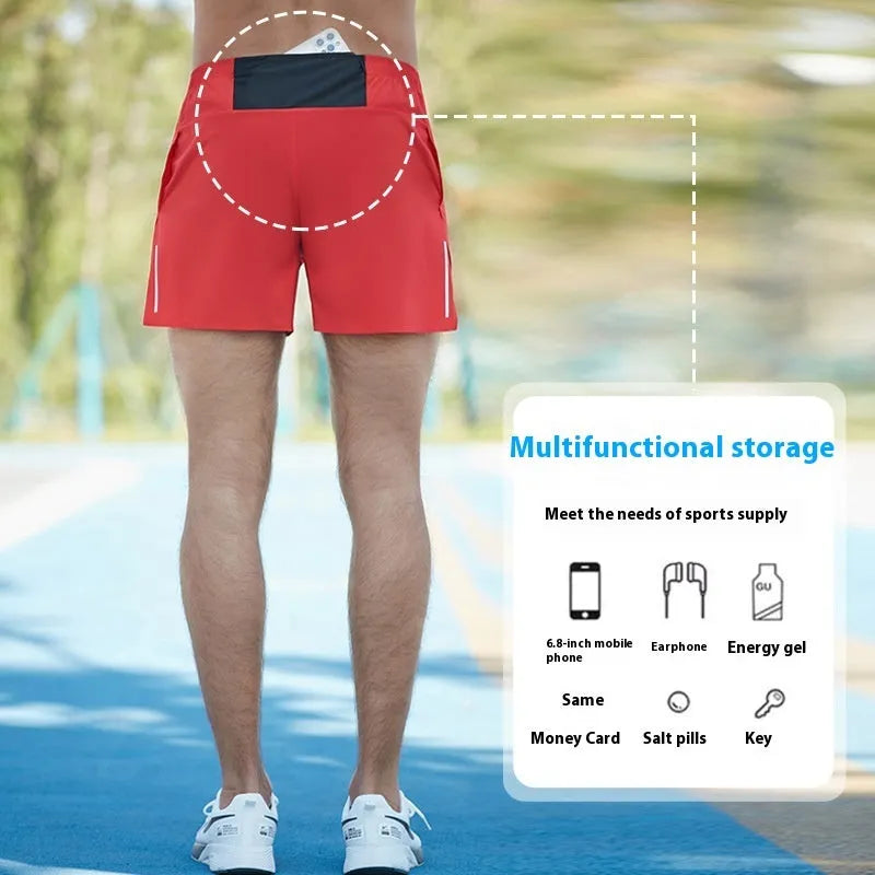Man wearing red high-waisted loose-fit off-road running shorts during a cross-country run.
