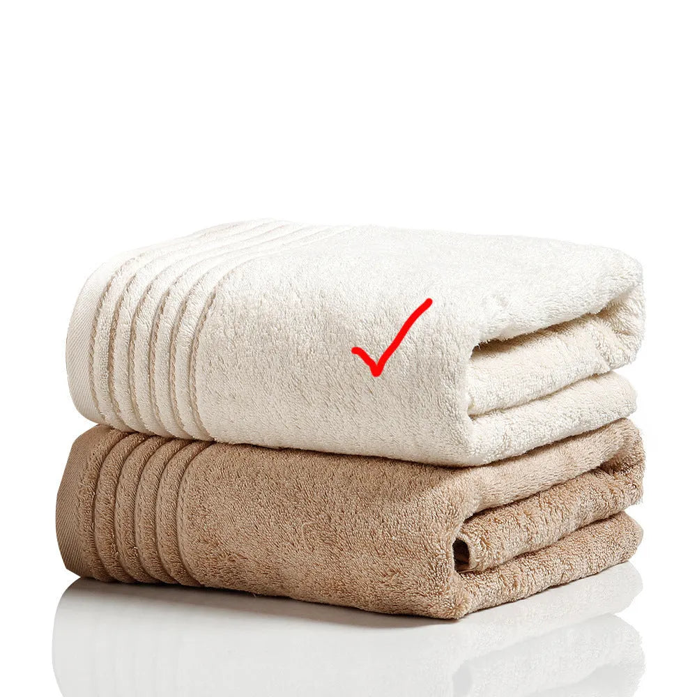 Beige and brown cotton towel set showing bath towel, hand towel, and face cloth sizes