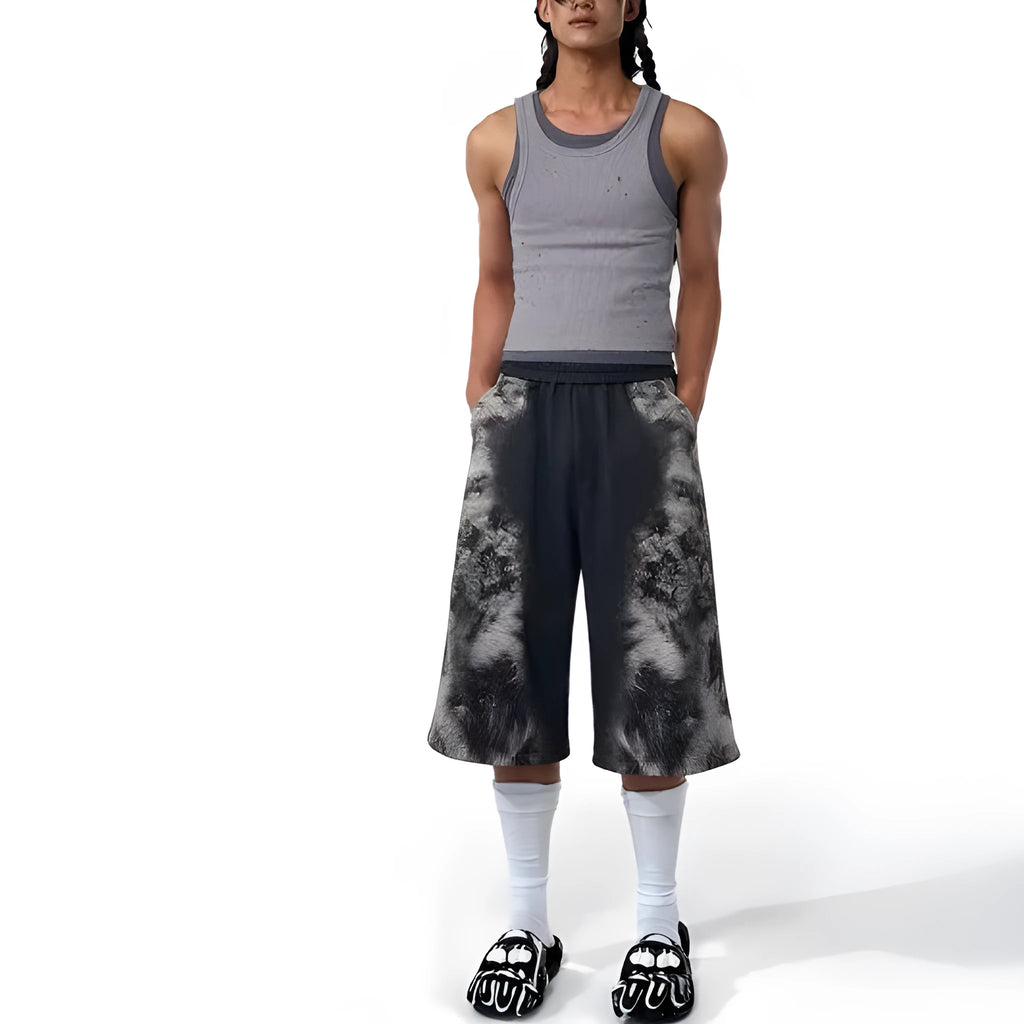 Streetwear co-ord set showing hoodie, full-length trousers, and seven-inch shorts with printed design and collage stitching detail.
