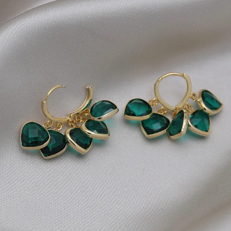 Green heart-shaped Korean style clip earrings with dancing pendant and artificial gemstones