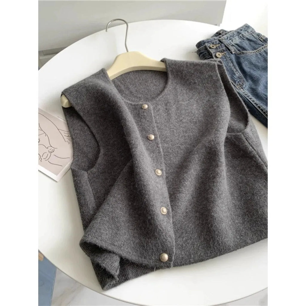 Women's thin grey polyester pullover vest with half sleeves, shown as a casual layering piece.