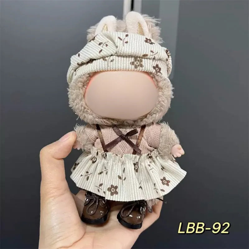 Plastic doll clothes for a 17cm tall vinyl figure on a white background.