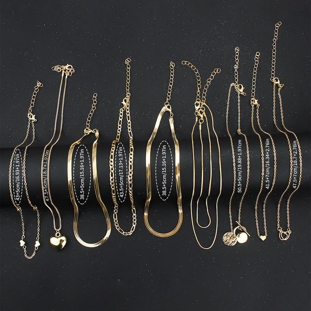Ten gold electroplated women's necklaces with alloy pendants on snake bones chains