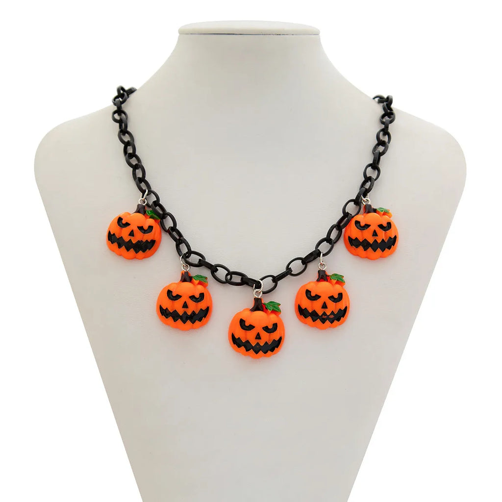 Halloween necklace showing a cartoon ghost and pumpkin acrylic pendant on a chain, colour 06705.