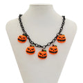 Halloween necklace showing a cartoon ghost and pumpkin acrylic pendant on a chain, colour 06705.