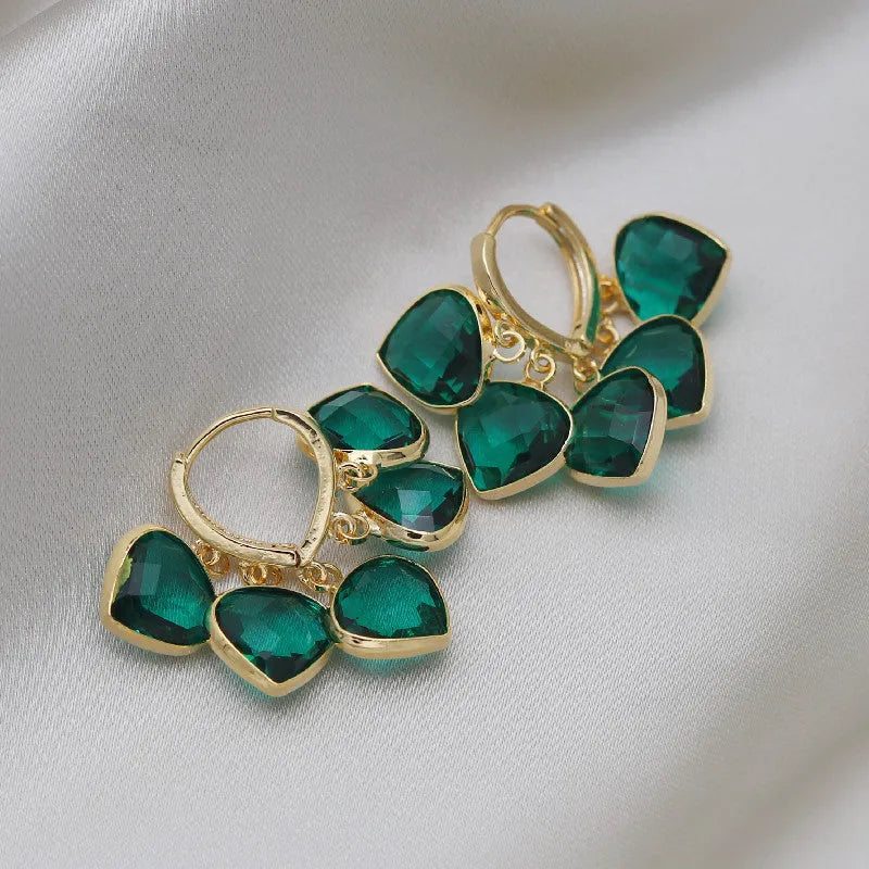 Green heart-shaped Korean style clip earrings with dancing pendant and artificial gemstones