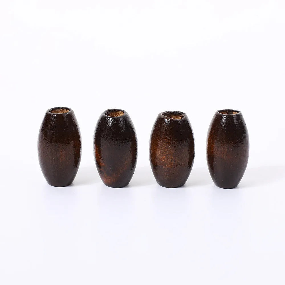Dark coffee coloured oval wooden beads with M-shaped raised profile and baking varnish finish