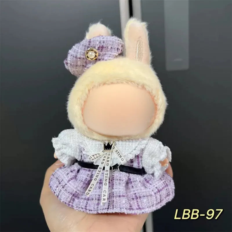 Plastic doll clothes for a 17cm tall vinyl figure on a white background.