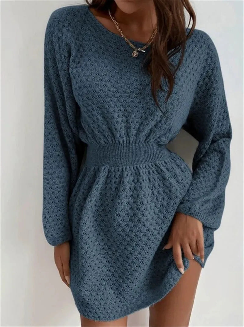 Blue women's knitted dress with hand-crocheted flowers, fitted waist, and 65cm length