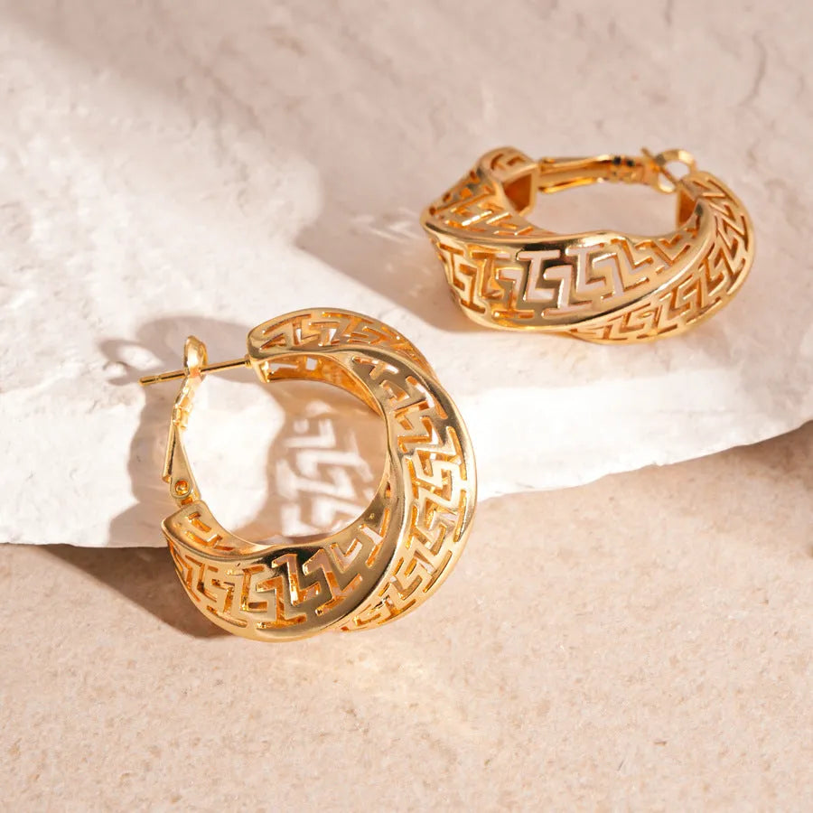 Geometric twisted round hollow stud earrings in gold or silver tone finish