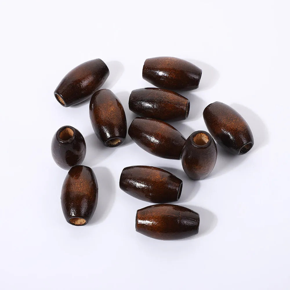 Dark coffee coloured oval wooden beads with M-shaped raised profile and baking varnish finish