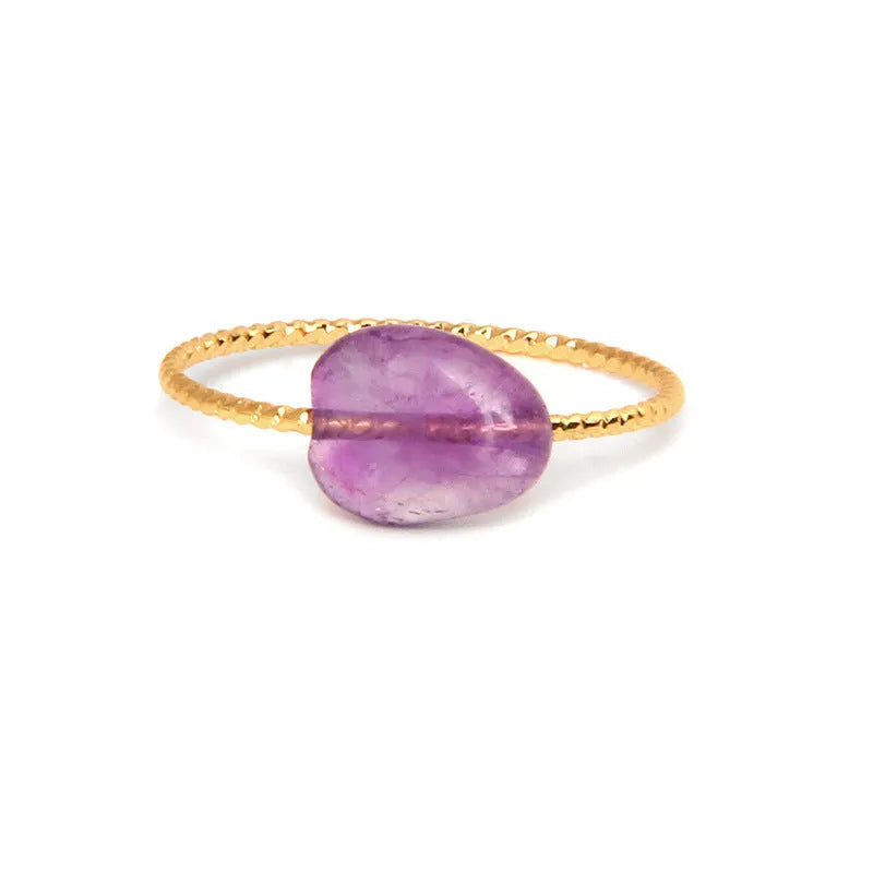 Women's geometric niche design ring with a coloured agate stone centrepiece.